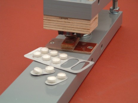 Paperfox MP-1 press with a special cutting plate for cutting medicine blisters